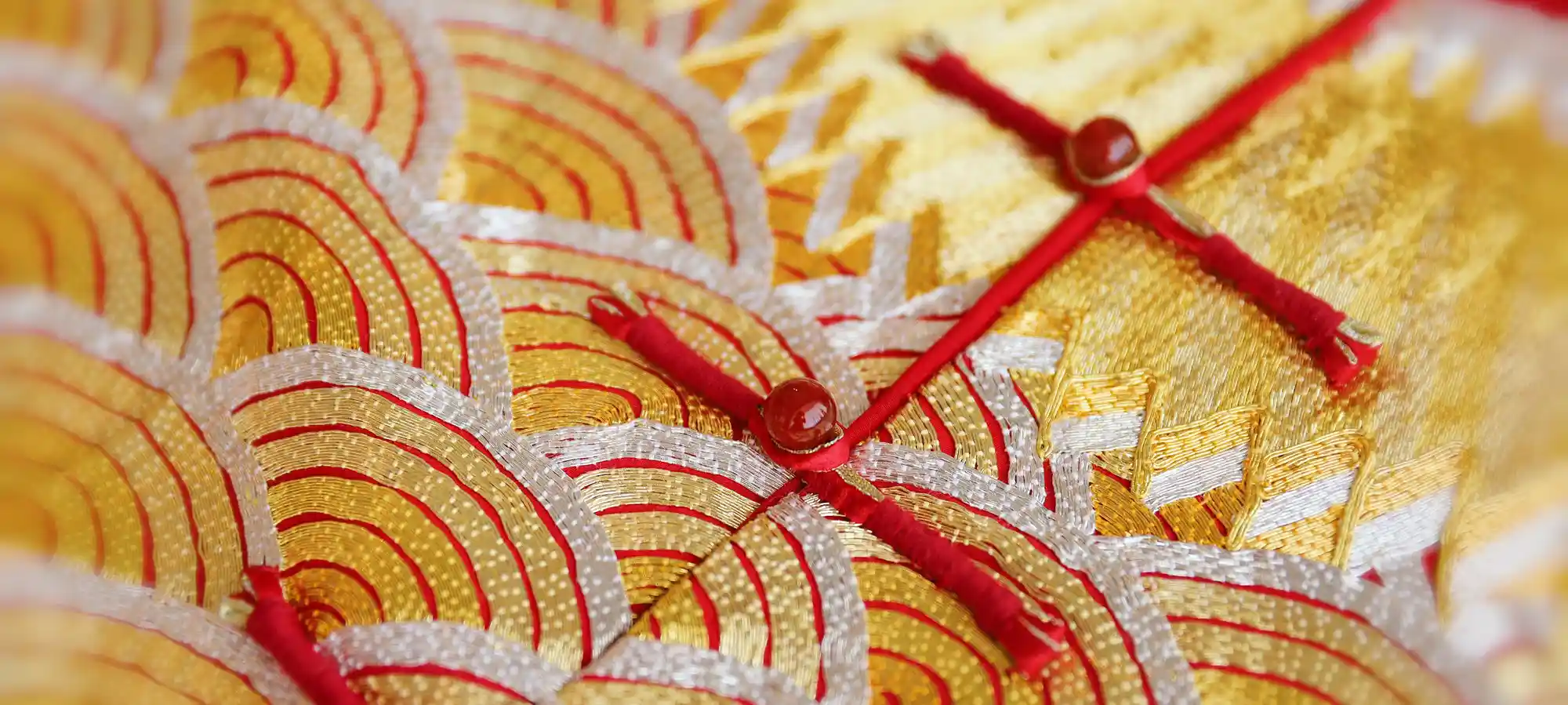 Crafting traditional Tang suits, blending Tangzhuang style and Chinese heritage.